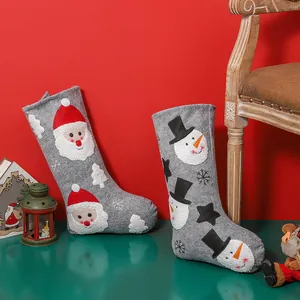 Felt Christmas stocking bags featuring Santa and Snowman embroidery for tree decoration