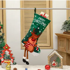 Detail of green Christmas stocking with reindeer character and hanging long legs