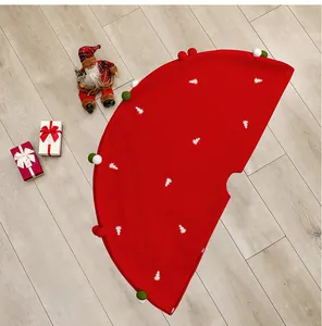 Red Christmas tree skirt with embroidered white trees and colorful plush pompom trim