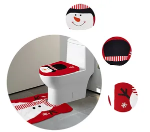 Detail of red plush Christmas toilet cover set with snowman motif and soft texture