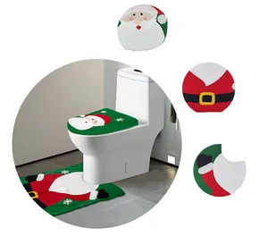 Detail of soft plush Santa Claus toilet seat cover and matching floor mat bathroom set
