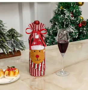 Close-up of reindeer wine bottle cover with red and white stripes and ribbon detail