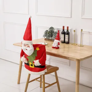 Christmas chair cover set featuring Santa Claus design and a plush red hat gnome doll
