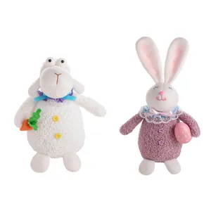 Easter plush set with white sheep holding carrot and pink rabbit holding decorative egg