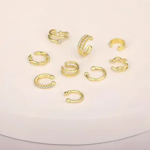 Set aus 9 vergoldeten Ohrmanschetten aus Messing mit Zirkon-Inlays und Stern-Motiven