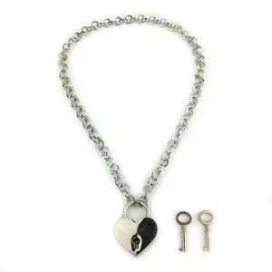 Silver cuban chain necklace featuring a black and white heart lock pendant with two keys