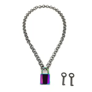 Macro view of gunmetal chain necklace featuring iridescent padlock pendant and keys