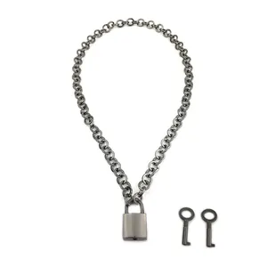 Detail of gunmetal chain necklace with rectangular padlock pendant and twin keys