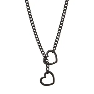 Detailed macro of black hollow heart pendant on thick adjustable Cuban link chain