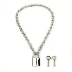 Close-up of silver-tone Cuban chain necklace with rectangular padlock and two keys