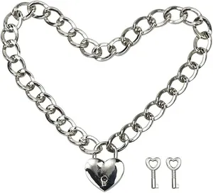 Macro detail of silver-tone chunky Cuban chain with heart padlock and decorative keys