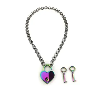 Detailed macro view of iridescent rainbow plated heart padlock and keys on Cuban chain