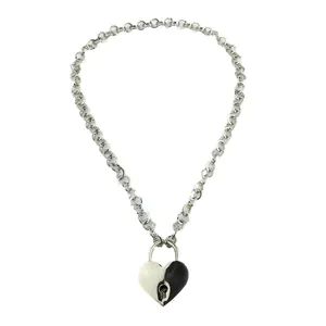 Silver Cuban chain necklace featuring a two-tone black and silver heart lock pendant