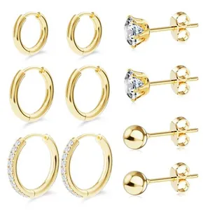 Detailed set of four gold-plated earrings featuring cubic zirconia and sleek hoops
