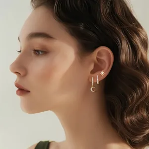 Three-piece set of gold-plated brass earrings with moon and star zircon accents