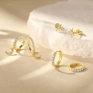 Three-piece gold brass earring set with zircon star moon hoops and huggie studs