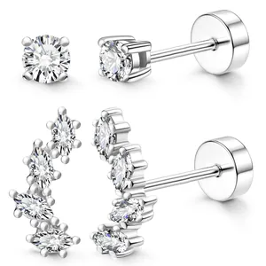 Detailed view of silver zircon stud earrings and marquise ear climber with flat backs