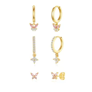 Detail of 18K gold brass butterfly earrings set with sparkling pink and white zirconia