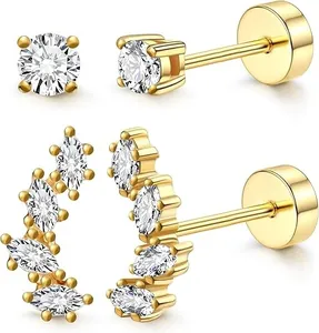 Detail of 14K gold plated brass stud earrings set with marquise and round cubic zirconia