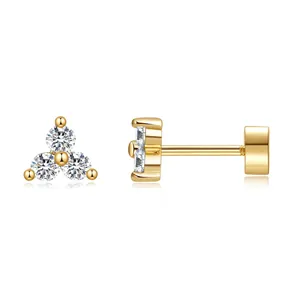 Detail of 18K gold brass stud earring with a three-stone zircon flower cluster design