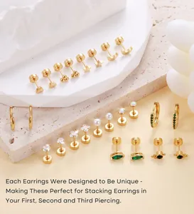 Detailed set of gold plated star and moon earrings with green zircon and pearls