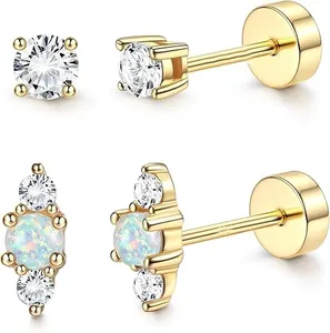 Detailed close-up of 18k gold plated stud earrings featuring round zircon and opal stones