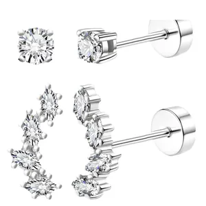 Set of gold-plated brass stud earrings with sparkling cubic zirconia on white background