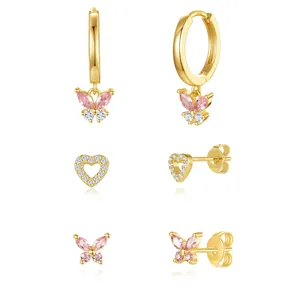 Detail of 18K gold plated brass butterfly earrings set with sparkling pink zircons