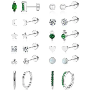 Silver earring set featuring 12 pairs of star, moon, and green zircon stud and hoop designs