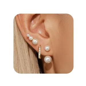 Detailed view of 18k gold plated brass earring set with zircons and gradient pearls