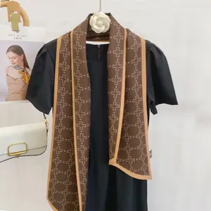 Fashionable brown satin scarf with star pattern and leopard border on black top