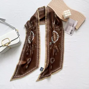 Elegant dark brown satin silk scarf featuring retro key motifs and beige borders