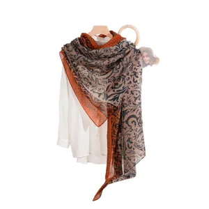 Lightweight long scarf with retro vine print in orange and indigo blue for women