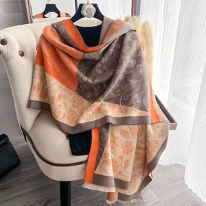 Detail of floral dot pattern and fringe on heavy oversized winter shawl scarf