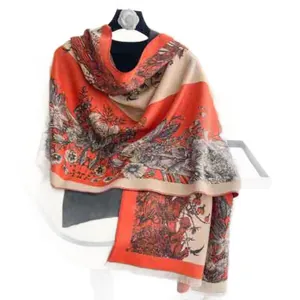 Floral cashmere-feel shawl with orange and beige patterns and fringed edges