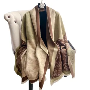 Winter scarf with floral dots, geometric patterns, and tassels in warm earth tones