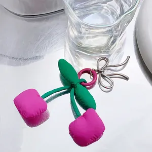 Handmade cherry bow fabric keychain charm with pink cherry fruits and silver metal detail
