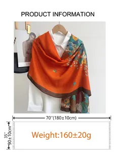 Detail view of large cotton linen scarf with floral print and 180x90cm size measurement