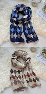 Close-up of thick winter scarf featuring classic argyle patterns and delicate fringe edges