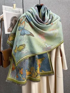 Close-up of butterfly oil painting pattern on thick cashmere shawl with fringe details