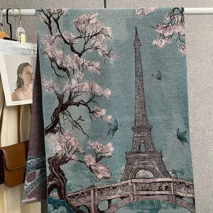 Detail of pashmina scarf featuring Eiffel Tower, pink cherry blossoms and blue butterflies