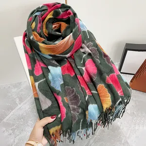 Luxurious dark green scarf with colorful autumn ginkgo leaf print and soft tassel edges