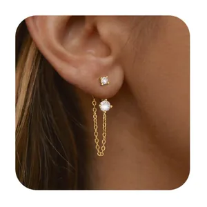 Detailed view of elegant gold chain earring featuring two sparkling zircon stones