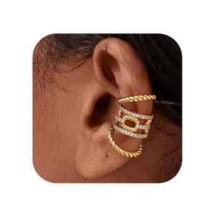 Gold-plated braided ear cuff with sparkling zircon rows shown on a model's ear