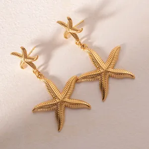 Luxuriöse goldene Seestern-Ohrhänger mit eleganten langen Fransen und Meeresstruktur