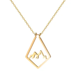 Macro shot of 18k gold plated hollow mountain pendant necklace with geometric diamond frame