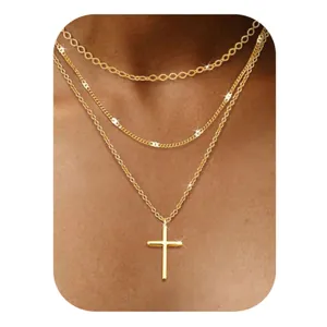 Three-layer layered gold necklace set with chunky link chain and polished cross pendant