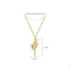 Vue détaillée du pendentif conque avec perles et cristaux incluant les dimensions