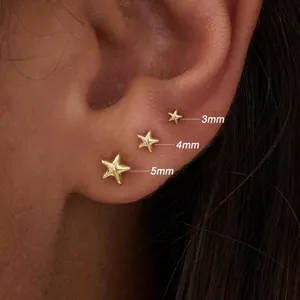 Detailed model shot of gold starfish studs in 3mm, 4mm, and 5mm sizes on the ear