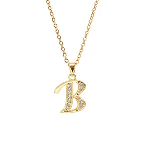 Detail of 14K gold plated necklace featuring a zircon-encrusted letter B pendant